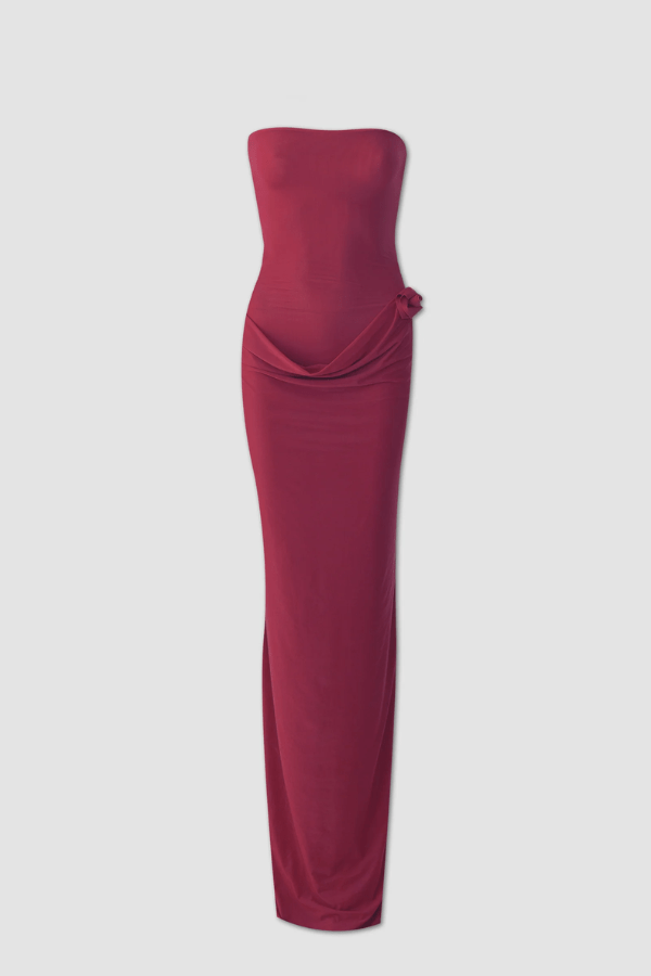 Campano Crimson by Maygel Coronel – A sleek strapless column dress with front twist draping and signature 3D floral detail, perfect for sophisticated evening events.