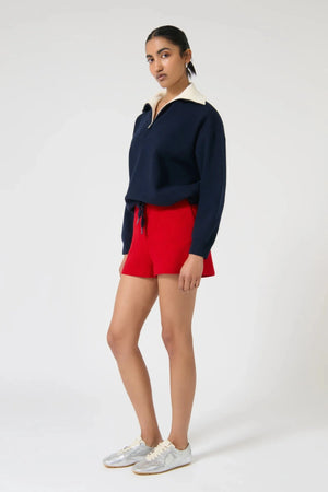 Onte Nerea Sweater in navy and ivory with half zip, two-tone collar, drawstring waist, and relaxed oversized fit.
