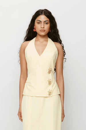 Inka Vest Top Aqua by The Wolf Gang, a halter crop with custom hardware and asymmetric closure. Perfect for sets or sleek solo styling.