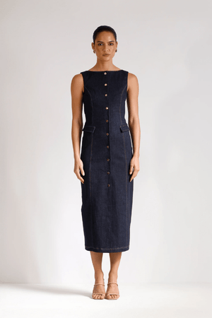 Good Vibes Midi Indigo by Pasduchas – Trendy stretch denim midi with contrast stitching, gold snaps, and tailored pockets, perfect for sleek day-to-night style.