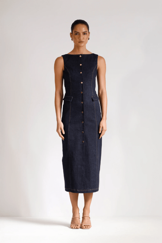 Good Vibes Midi Indigo by Pasduchas – Trendy stretch denim midi with contrast stitching, gold snaps, and tailored pockets, perfect for sleek day-to-night style.