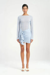 Faris Mini Dress Sky by Benni, featuring a boat neckline, long sleeves, diamante mesh bodice, and asymmetrical skirt with side drape for a graceful silhouette. Ideal for elegant evening.