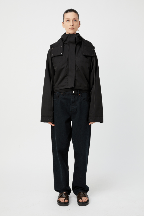 Cella Short Puffer Black by Camilla and Marc – Cropped monogram puffer with oversized sleeves, flap pockets, and utility details for elevated outerwear.