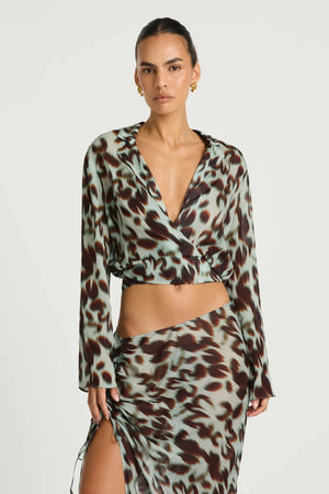 Leni Wrap Top in Motion Floral by Benni, a sheer chiffon wrap top with deep V neckline, wide sleeves, and adjustable waist tie.