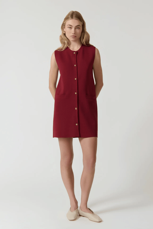 Nanda Dress Burgundy by Onte – Trendy sleeveless shift in heavy Milano knit with gold knot buttons, flattering A-line silhouette, perfect for chic day or night looks.