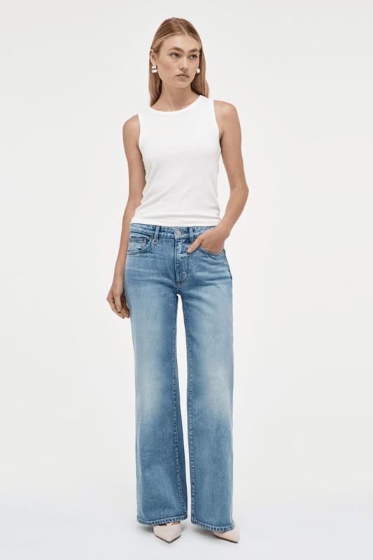 Eva Wide Arrival by Neuw Denim, trendy mid-rise jeans with a wide leg fit, crafted from cotton-rich denim. Perfect for a comfortable yet edgy look, featuring a classic button and zip fly with front and back pockets.