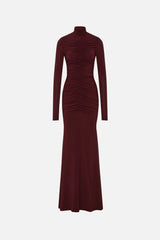 The Gathered Long Sleeve Maxi Dress by MISHA, ruched jersey maxi with mock neck and flared hem for sculpted evening styling.