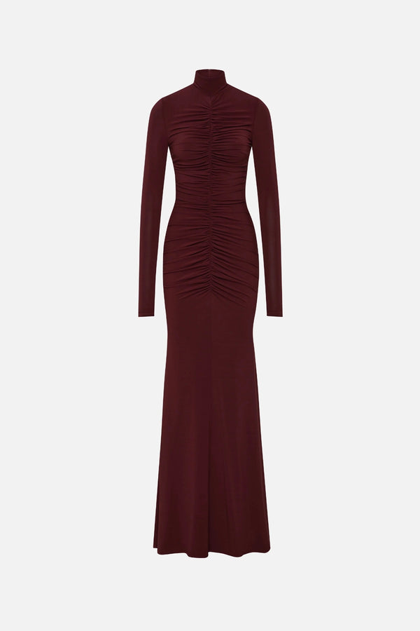 The Gathered Long Sleeve Maxi Dress by MISHA, ruched jersey maxi with mock neck and flared hem for sculpted evening styling.