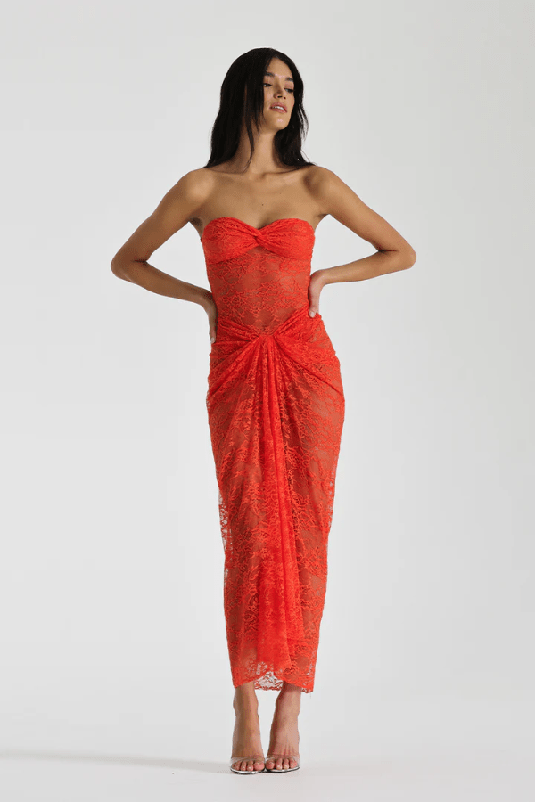 Naomi Dress Tangerine by Natalie Rolt – A strapless lace dress with ruched knot detail and soft draping, perfect for summer weddings, garden parties, or sunset soirées.