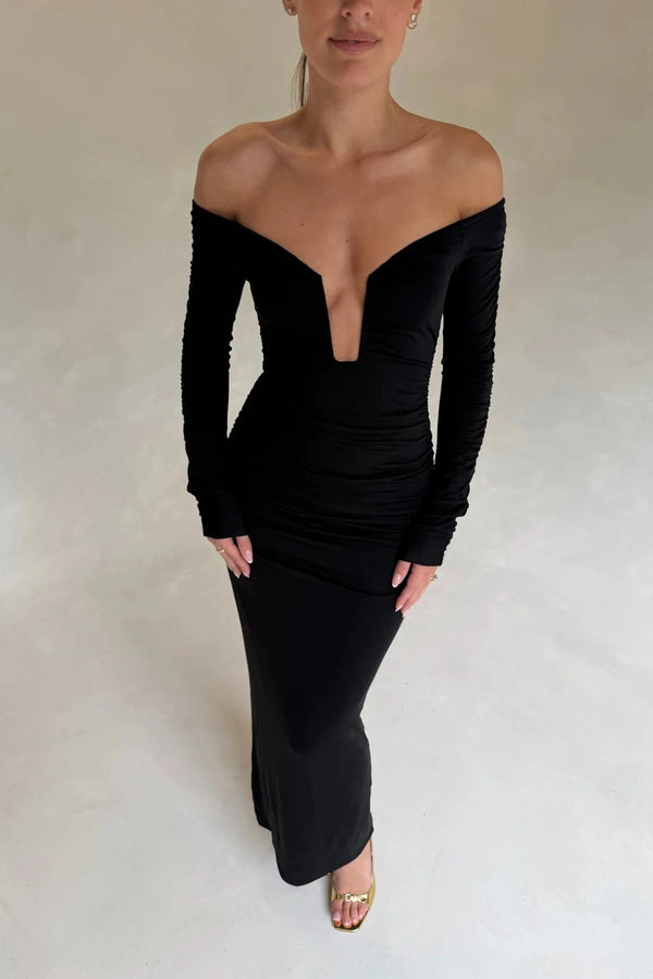 Black Haley off-shoulder midi dress with fitted bodice and flowy skirt, featuring short sleeves and a subtle slit.