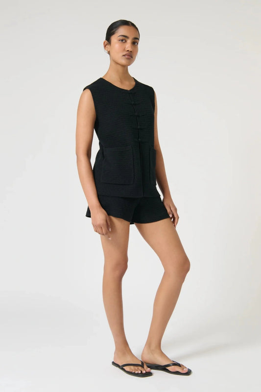Onte Helena Shorts in black cotton crochet knit with elastic waistband, mini fit, styled with matching Helena Gilet.