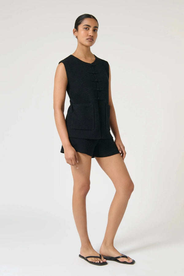 Onte Helena Shorts in black cotton crochet knit with elastic waistband, mini fit, styled with matching Helena Gilet.