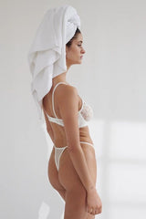 Rosie Thong in White by Kat the Label, high-cut lace thong with a soft mesh back and adjustable waistband, perfect for blending comfort with romantic elegance.