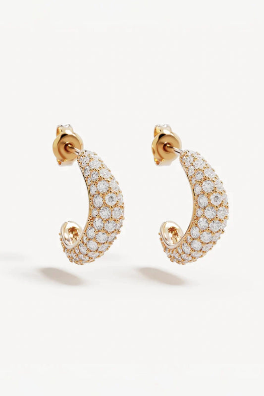 Crystal Wave Hoops by by charlotte — gold vermeil wave-shaped hoops with pavé crystals, perfect for elegant event styling.
