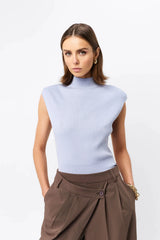 Quiet Force Top by Mossman in sky blue, ribbed sleeveless turtleneck with removable shoulder pads for sleek everyday styling.
