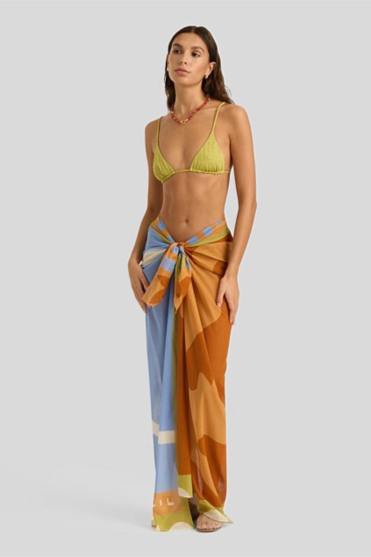 Square Pareo by Soleil Soleil, an organic cotton wrap with abstract Kin print. Perfect as a beach skirt, scarf, or resort layer.