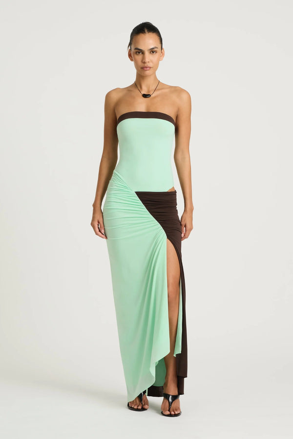 Rumi Strapless Maxi Dress in Aqua/Choc by Benni, ocean stripe asymmetric one-shoulder maxi with gathered skirt, adjustable cut-out and sculpting stretch fit.