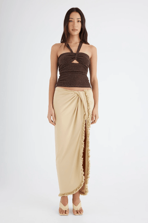 Bernie Fringe Skirt Butter by Benni — Midi skirt with mid-rise waist, front knot, side split, and fringe trim. Made from soft, comfortable jersey fabric.