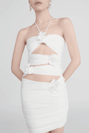 Coari Off White by Maygel Coronel – Ruched cutout halter mini dress with 3D flowers and adjustable straps for versatile wear.