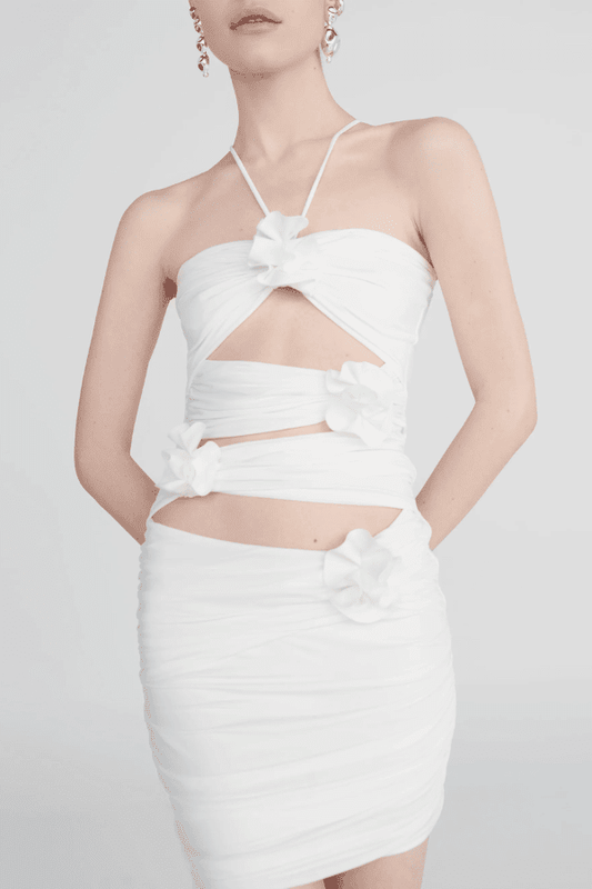 Coari Off White by Maygel Coronel – Ruched cutout halter mini dress with 3D flowers and adjustable straps for versatile wear.