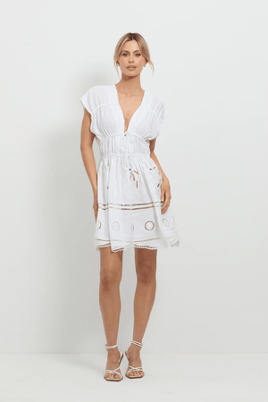 Sunrise Spirit Dress White by Pasduchas – A trendy, embroidered Tencel-linen blend dress with adjustable ties and scalloped hem, perfect for chic day-to-night occasions.