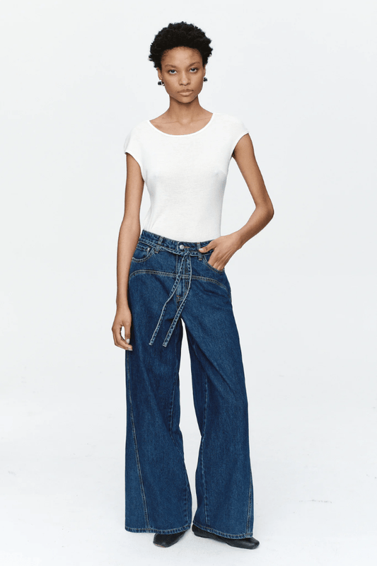 Tie Curve Seam Jean Heritage Blue by Marle, trendy mid-rise jeans with unique curved seam detailing and a relaxed, wide-leg fit. Perfect for a versatile, polished look with a detachable tie belt.