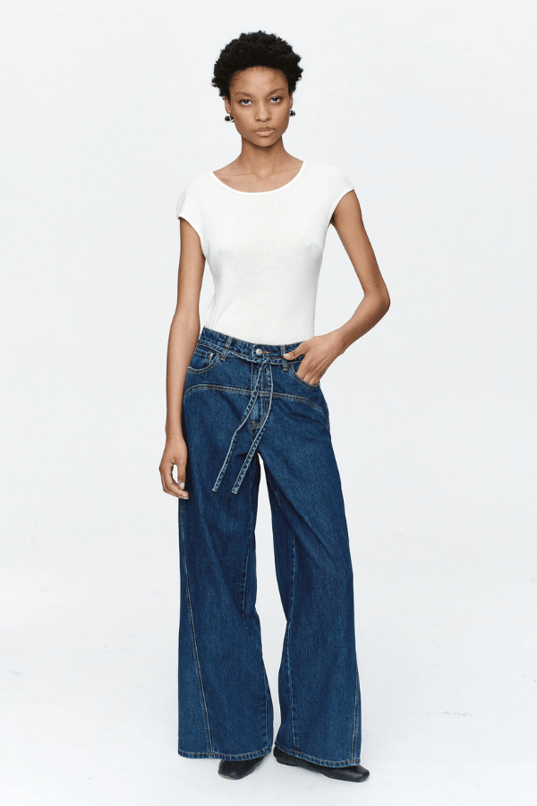 Tie Curve Seam Jean Heritage Blue by Marle, trendy mid-rise jeans with unique curved seam detailing and a relaxed, wide-leg fit. Perfect for a versatile, polished look with a detachable tie belt.