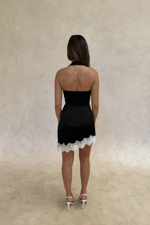 Lilah Lace Trim Mini Skirt by Sneaky Link – an asymmetrical mini with contrast lace detail. Perfect for elevated day-to-night styling.