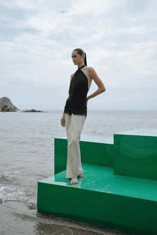 Linus Dress Ying Yang by Baobab – A trendy, versatile maxi with glossy fabric, adjustable halter straps, cut-outs, and a dramatic slit, perfect for bold occasions.