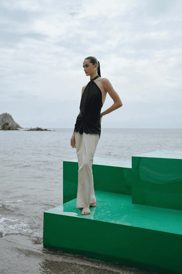 Linus Dress Ying Yang by Baobab – A trendy, versatile maxi with glossy fabric, adjustable halter straps, cut-outs, and a dramatic slit, perfect for bold occasions.