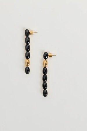 Edith Earrings in Black/Gold by Heaven Mayhem – gold twisted-bead drop earrings with sculptural movement and shine, perfect for refined everyday styling.