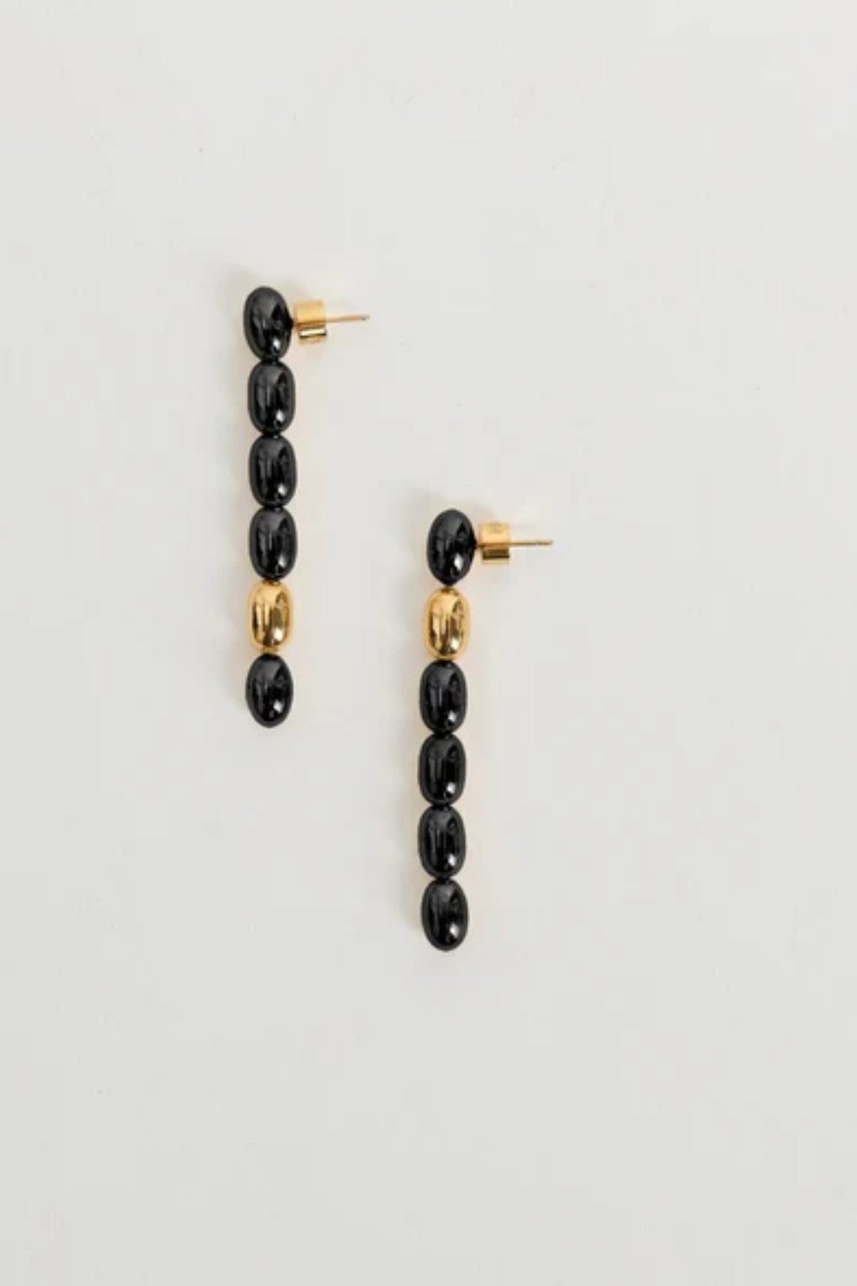 Edith Earrings in Black/Gold by Heaven Mayhem – gold twisted-bead drop earrings with sculptural movement and shine, perfect for refined everyday styling.