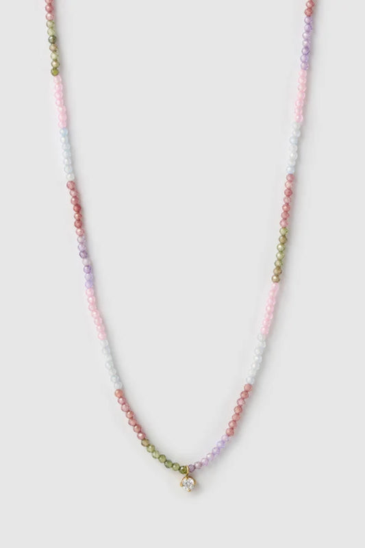 Taylor Necklace by Arms of Eve, delicate gold chain with multi-coloured zircon stones and charm for a playful, twinkling touch of elegance.