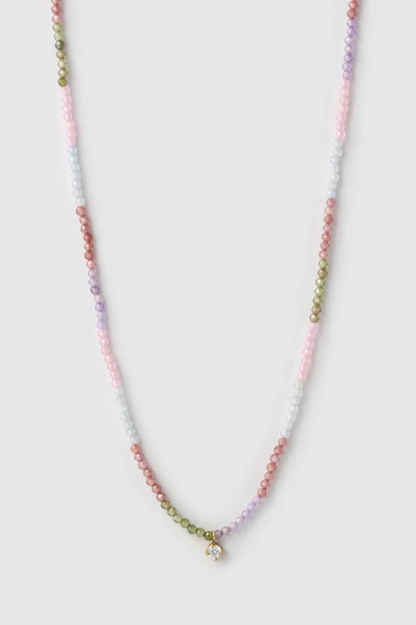 Taylor Necklace by Arms of Eve, delicate gold chain with multi-coloured zircon stones and charm for a playful, twinkling touch of elegance.