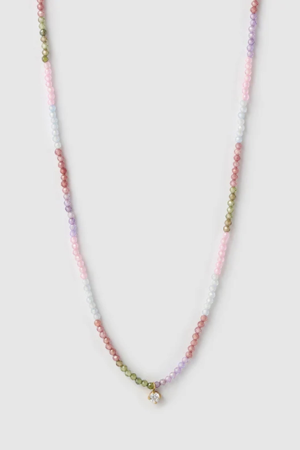 Taylor Necklace by Arms of Eve, delicate gold chain with multi-coloured zircon stones and charm for a playful, twinkling touch of elegance.