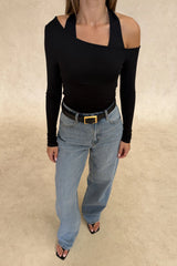 Issy Long Sleeve Top Black by Sneaky Link – Luxuriously soft modal-spandex with an off-shoulder neckline and built-in halter for support. Delicate fabric; handle gently. Cold hand wash.
