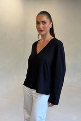Carter V Neck Long Sleeve Top in Black by Sneaky Link, cotton V-neck long sleeve top for effortless everyday layering.
