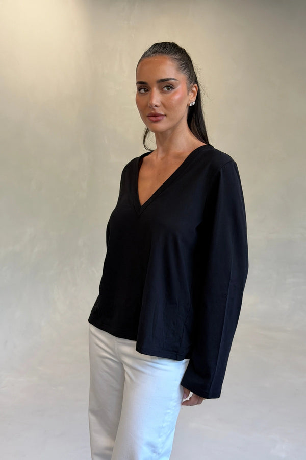 Carter V Neck Long Sleeve Top in Black by Sneaky Link, cotton V-neck long sleeve top for effortless everyday layering.
