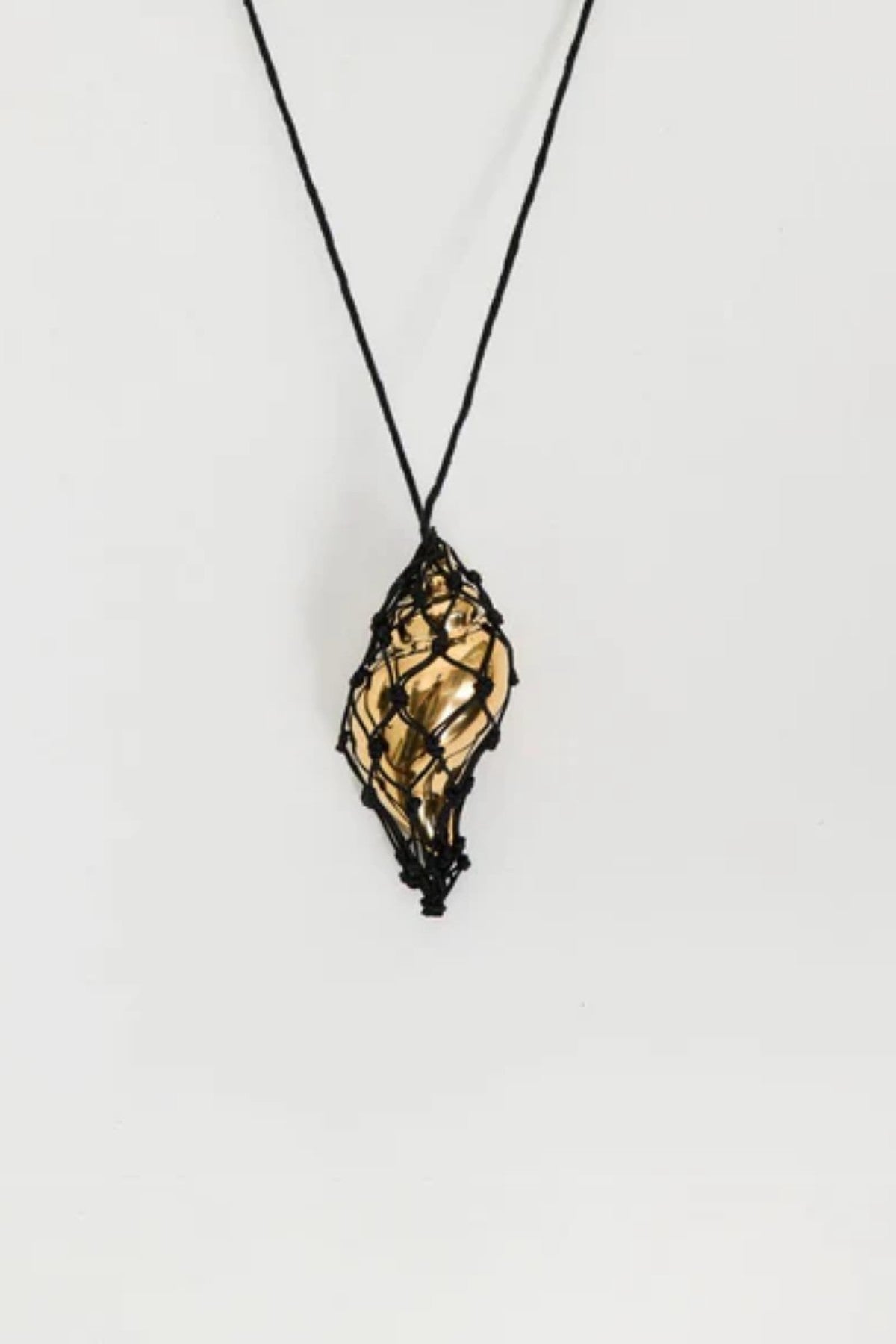 Sterling Necklace in Black/Gold by Heaven Mayhem – a black and gold knotted cord necklace with a sculptural shell pendant, perfect for bold modern styling.