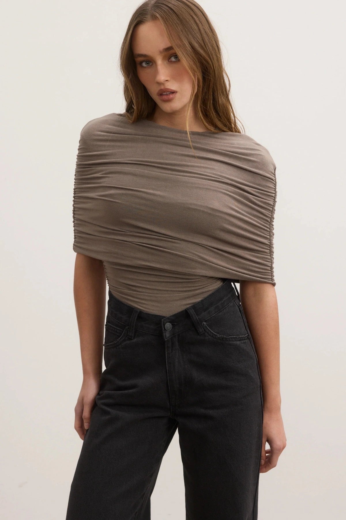 Bayse Daisy Bodysuit in Mink, a sculpted stretch-fit design with high neckline and all-over ruching for a sleek finish.