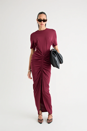 Niko Maxi Dress Burgundy by Pfeiffer – Trendy relaxed T-shirt maxi with adjustable side ruching, crew neck, and breathable cotton blend, perfect for elevated off-duty style and everyday comfort.