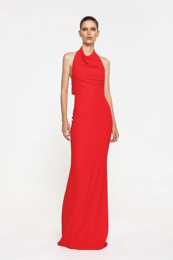 Sydney Gown Red by Effie Kats – A bold and trendy stretch-jersey gown with elegant ruching and a daring thigh-high split, perfect for special evening occasions.