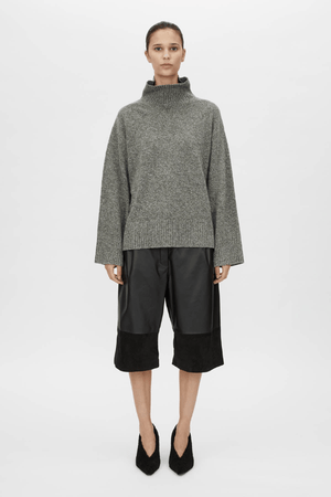Breccia Knit Sweater Khaki by Camilla and Marc – Trendy oversized merino wool sweater with ribbed details and a modern split back, perfect for casual layering.