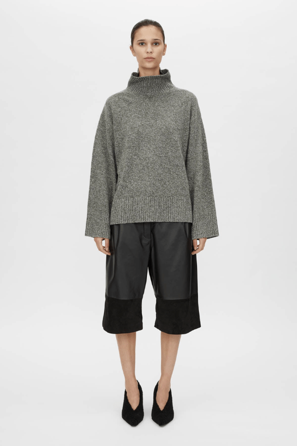 Breccia Knit Sweater Khaki by Camilla and Marc – Trendy oversized merino wool sweater with ribbed details and a modern split back, perfect for casual layering.