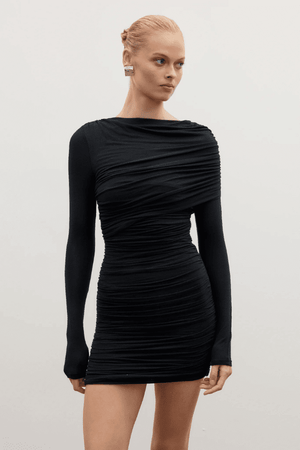 Kai Mini Dress Shadow by Bayse – Trendy ruched mini with asymmetric draped bodice, high boat neck, and bold deep V-back. Perfect for chic nights out and special events.