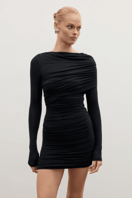 Kai Mini Dress Shadow by Bayse – Trendy ruched mini with asymmetric draped bodice, high boat neck, and bold deep V-back. Perfect for chic nights out and special events.