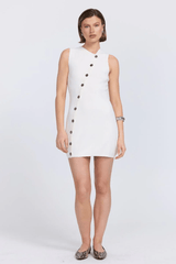 Astrid Knit Dress Almond by Sovere – A trendy vest-style mini with asymmetric neckline and button closure, blending structure with modern sophistication for versatile wear.