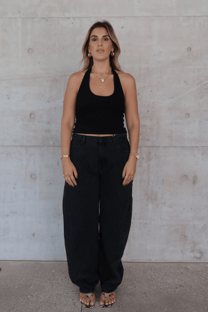 Bella Halter Tank Black by Sneaky Link – A chic, breathable cotton-spandex tank with a deep scoop neckline and open back, perfect for layering or solo wear.
