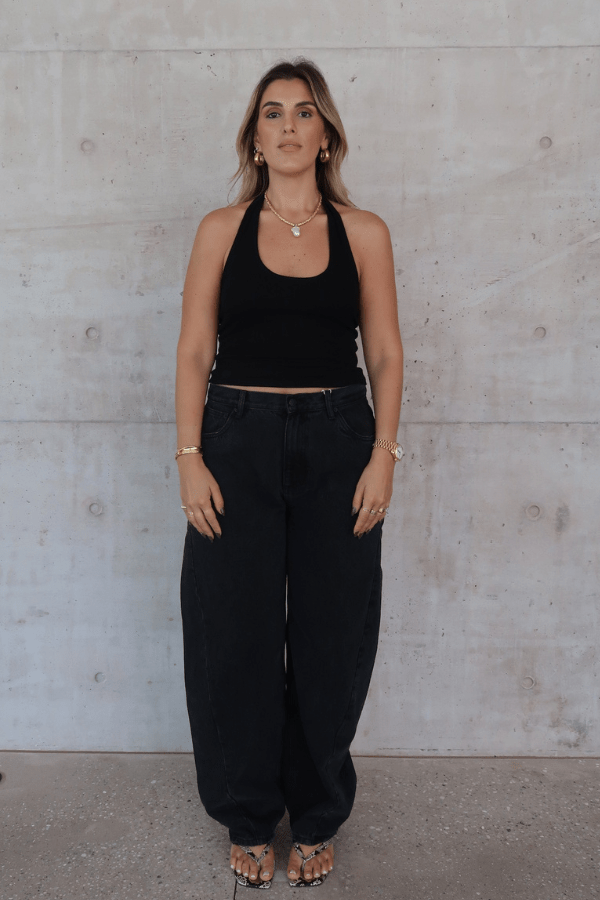 Bella Halter Tank Black by Sneaky Link – A chic, breathable cotton-spandex tank with a deep scoop neckline and open back, perfect for layering or solo wear.