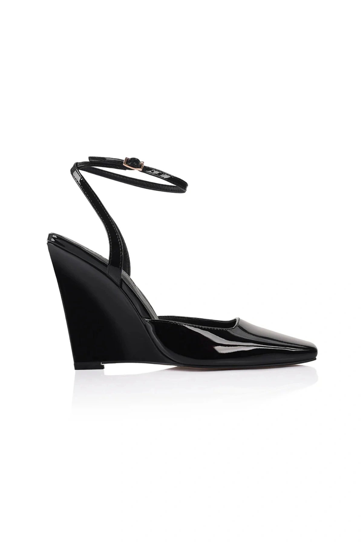 Lana Wilkinson Mona Wedge in black patent leather with pointed toe, high-cut vamp, ankle strap, and sculptural wedge heel.